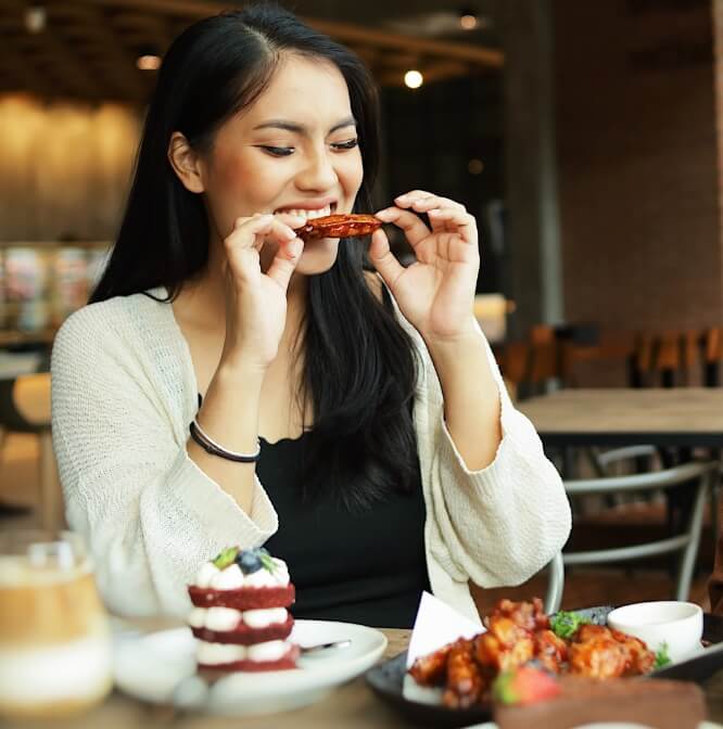 Woman eating at table